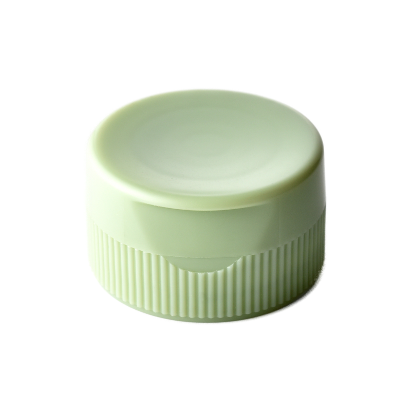 31/400 PP and TPE silicone valve cap for food and condiment, personal care and household care packaging, front view closed