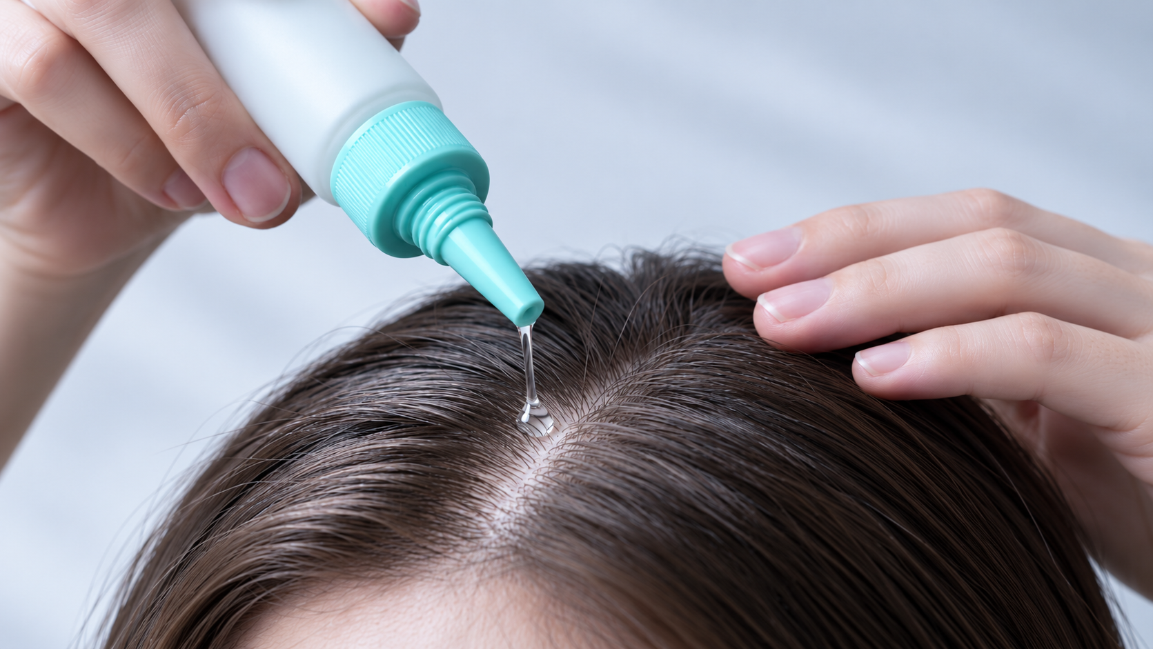 Scalp treatment application — nozzle cap in use